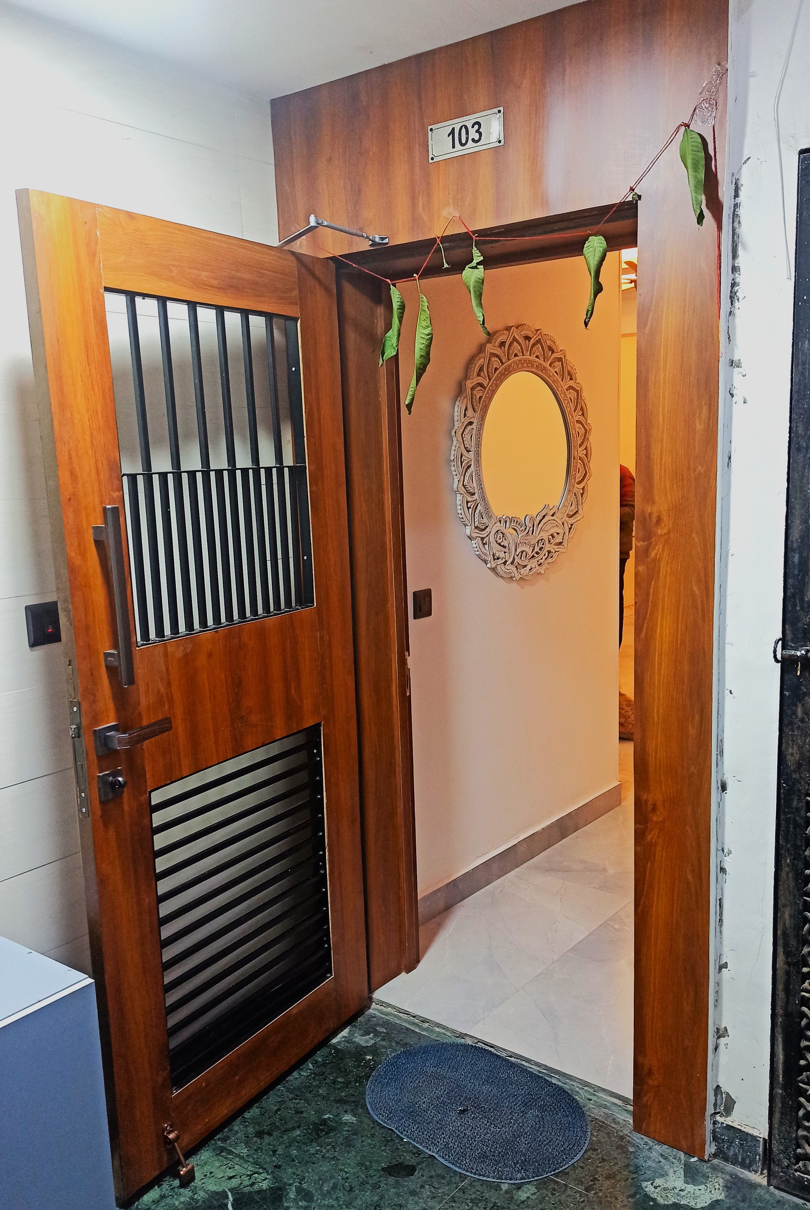 Engineered wooden entrance door with metal jali